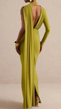 Back view of the chartreuse olive maxi dress with open back, one long sleeve, and flowing draped panel