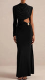 Front view of the black asymmetric maxi dress with waist cutout and floor-length silhouette