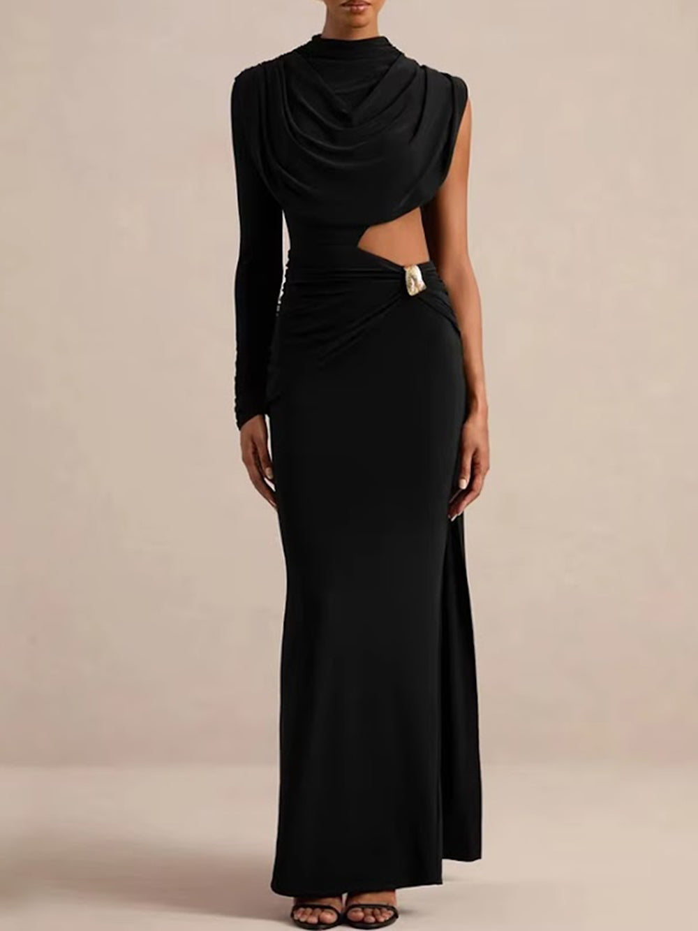 Front view of the black asymmetric maxi dress with waist cutout and floor-length silhouette