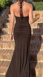 Back view of the espresso Camille maxi dress with a tied halter neck, open back, and floor-length hem