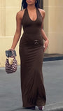 Front view of the espresso fitted maxi dress with a slim halter bodice and small metallic waist accent