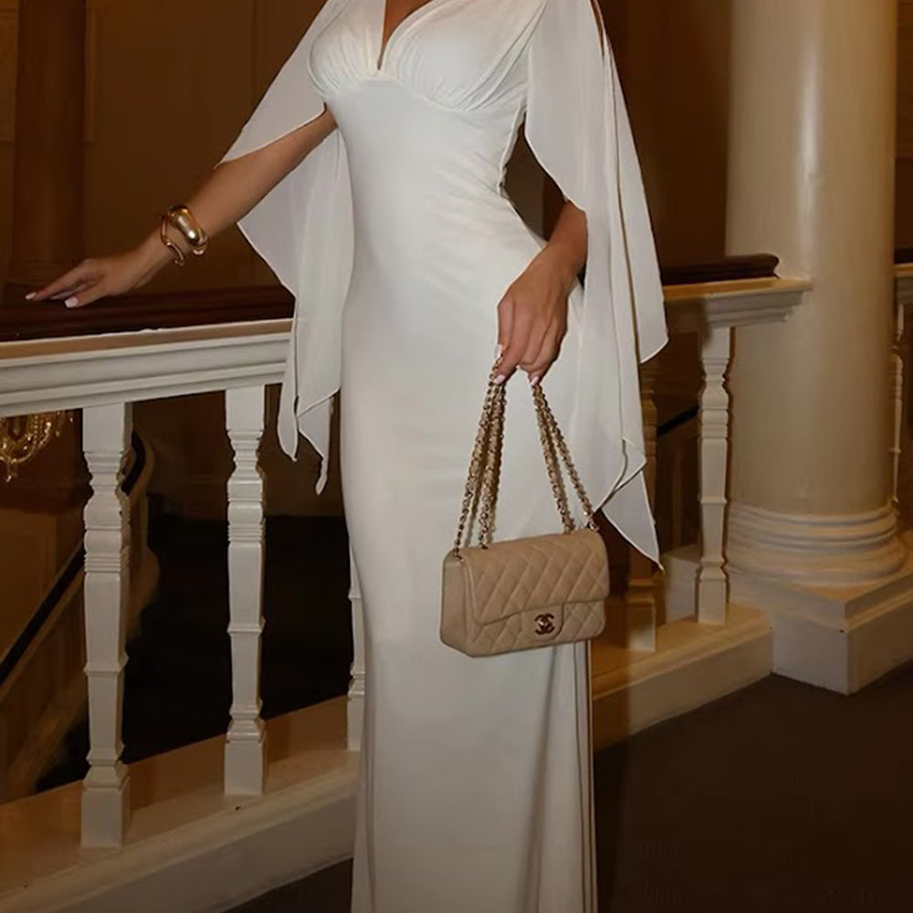 Full-length front view of the ivory gown with split cape sleeves and a fitted streamlined body