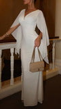Full-length front view of the ivory gown with split cape sleeves and a fitted streamlined body