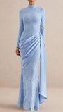Front view of the powder blue lace gown with high neckline, fitted silhouette, and floor-length overlay