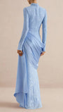 Back view of the powder blue lace gown with long sleeves and flowing side drape
