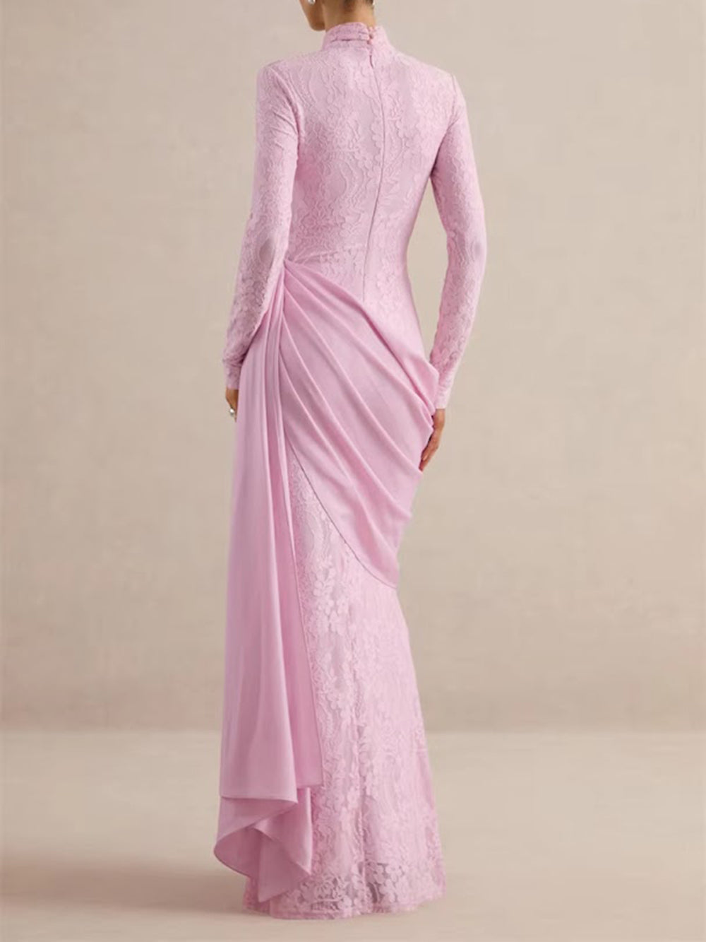 Back view of the blush rose gown featuring floral lace and a softly cascading hip overlay