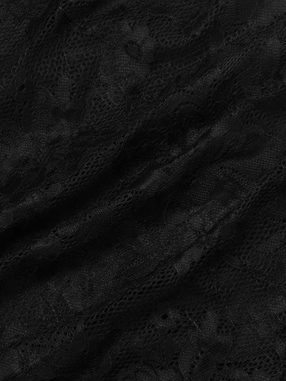 Close up of black floral lace showing the sheer patterned texture