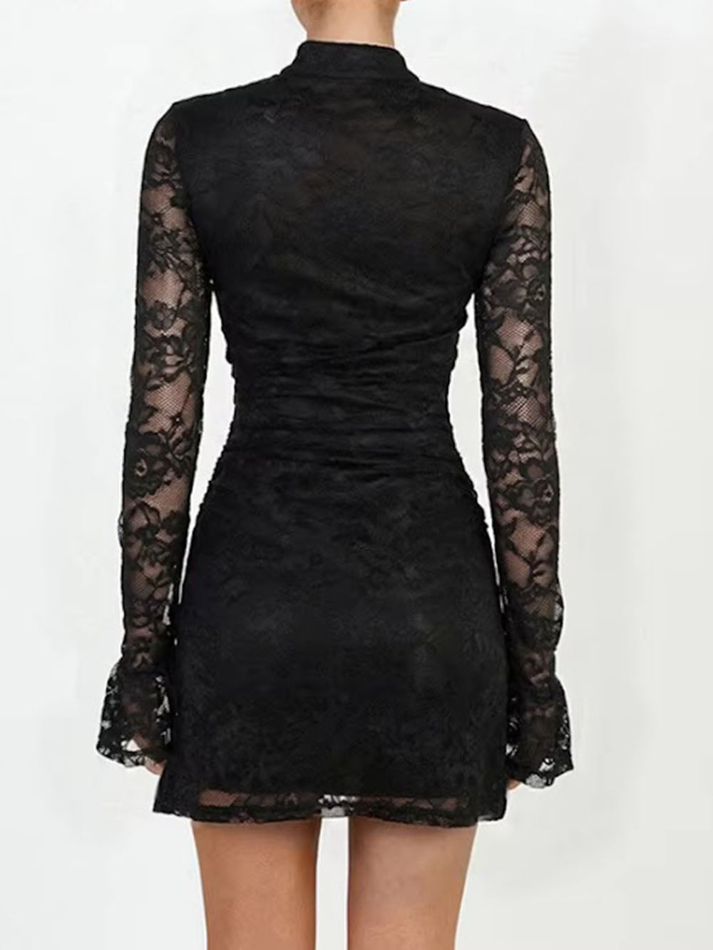 Back view of the black mini dress showing fitted floral lace and short flared hem