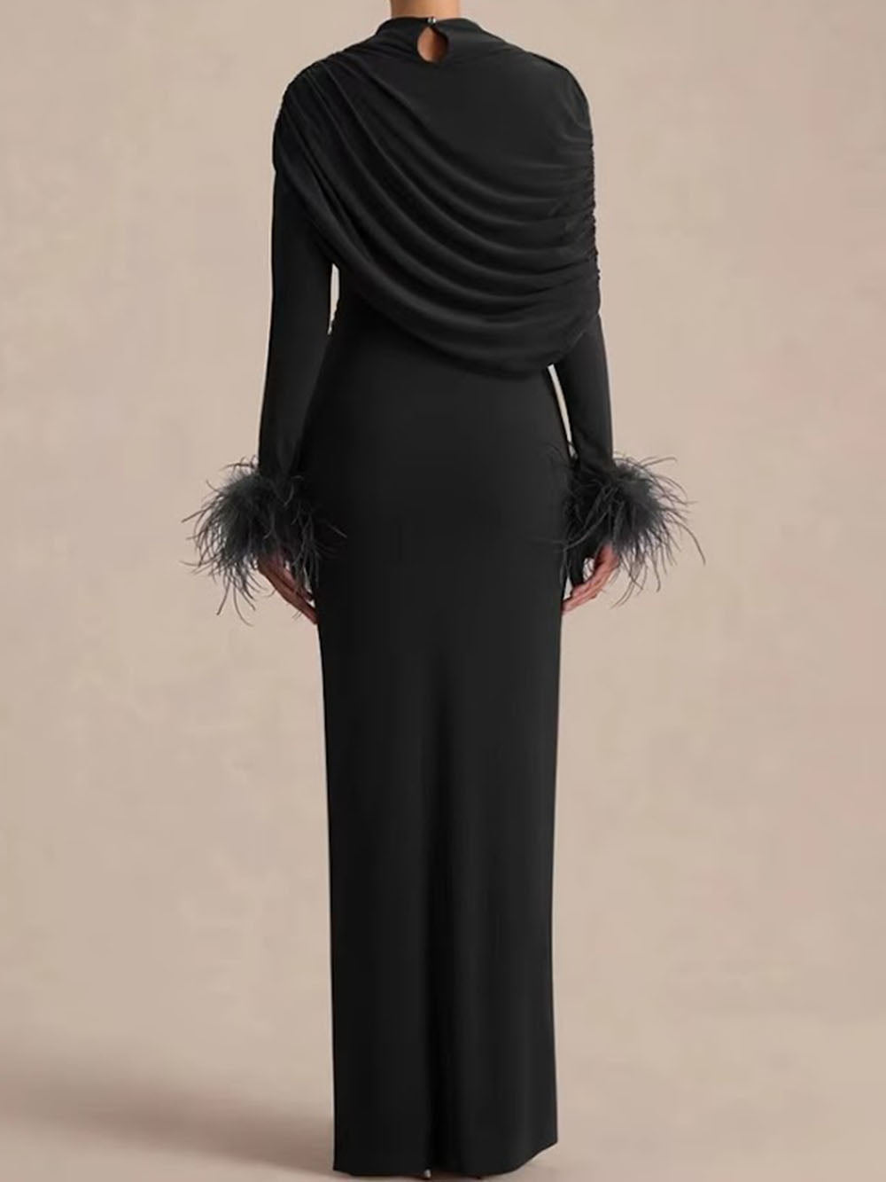 Back view of the blush pink dress showing the asymmetric draped shoulder and feather trim