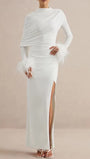 Front view of the white maxi dress with long sleeves, draped shoulder detail, and feather cuffs