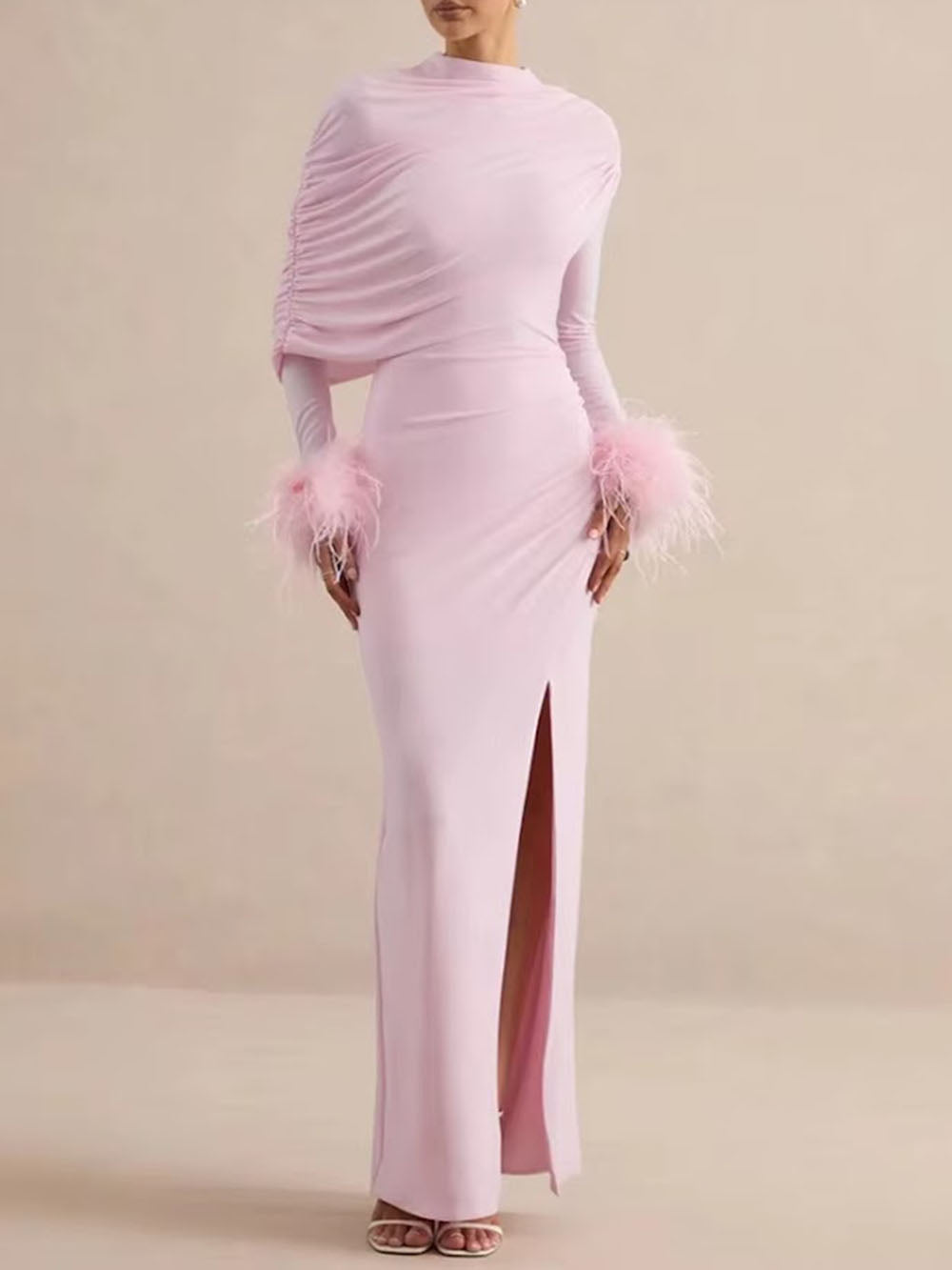 Front view of the blush pink maxi dress with fitted silhouette and feather-trimmed wrists