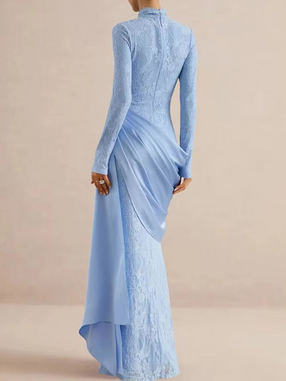 Back view of the powder blue lace gown with fitted long sleeves and cascading hip drape