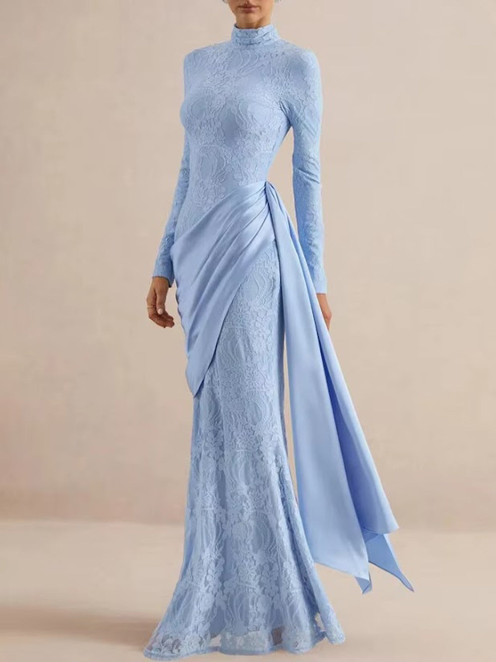 Full length front view of the powder blue gown with floral lace and flowing asymmetric panel