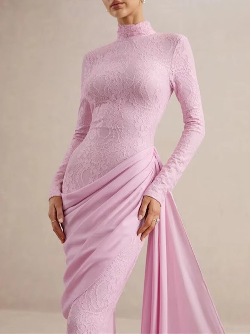 Close front view of the blush rose gown highlighting fitted lace and draped waist detailing