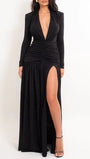 Front view of the black blazer gown with plunging lapels, long sleeves, and high thigh slit