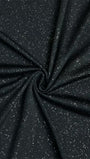 Close up of black textured fabric with a subtle light-catching finish