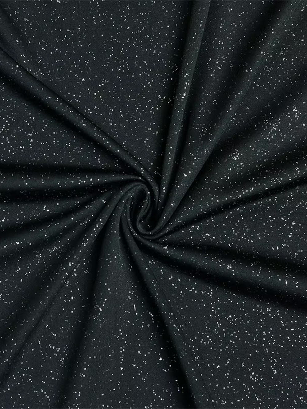 Close up of black textured fabric with a subtle light-catching finish