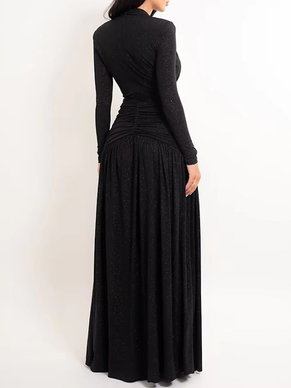 Back view of the black gown showing long sleeves and a full flowing skirt