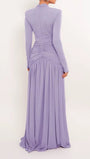 Back view of the lavender gown showing tailored shoulders and draped floor-length skirt