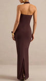 Back view of the brown halter maxi dress showing exposed shoulders and fitted floor-length silhouette