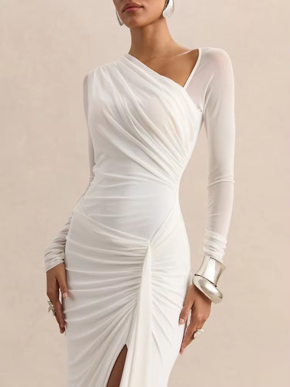 Full-length front view of the white gown with a ruched waist, high slit, and floor-length draped skirt