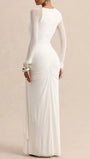 Back view of the white long-sleeve gown showing a fitted silhouette and gathered back hip detailing