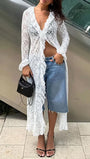 Model wearing the white lace blouse with denim and a black handbag