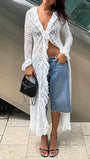 Full length view of the white sheer lace blouse styled open over jeans