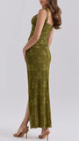 Angled side view of the green lace dress with a sculpted waist and high slit