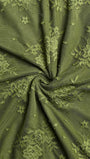 Close up of olive floral lace fabric showing the delicate patterned texture