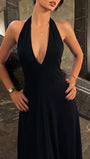 Back view of the sky blue midi dress showing the open halter back