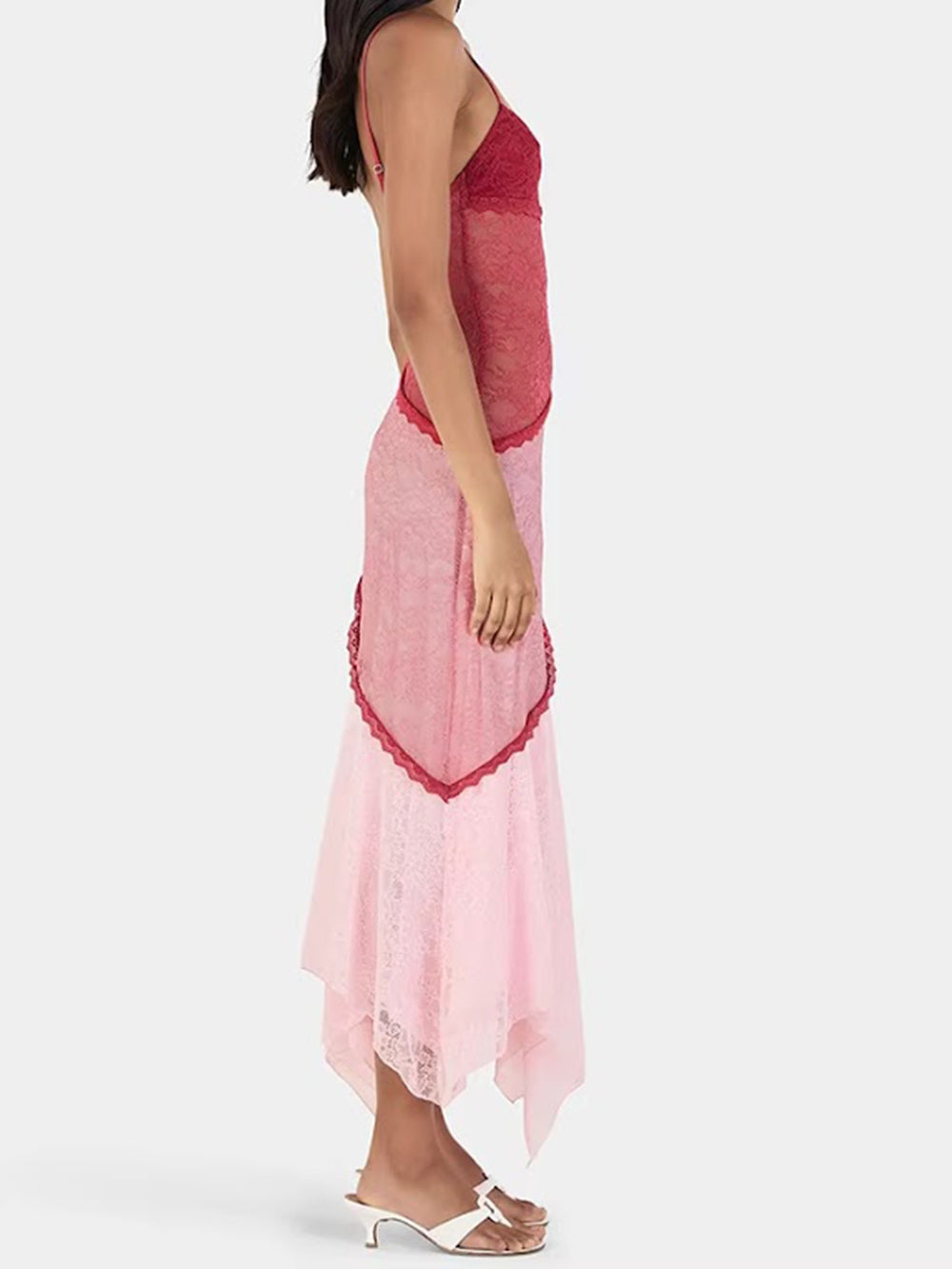 Side view of the two-tone lace midi dress showing its fitted bodice and uneven hemline