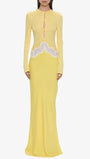 Front view of the butter yellow maxi dress with long sleeves, front keyholes, and lace waist detail