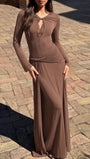 Outdoor front view of the mink maxi dress with long sleeves, keyhole neckline, and floor-length skirt