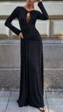 Three-quarter view of the black dress showing the keyhole neckline and gathered hip