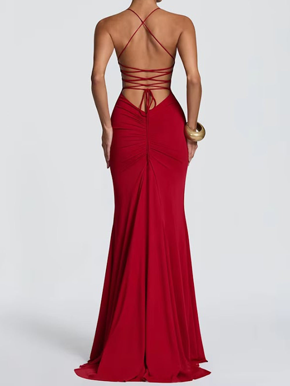 Back view of the crimson gown with multiple thin straps and a floor-sweeping hem